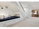 Basement staircase with a built-in bench, storage drawers, and access to a wet bar at 2130 S Milwaukee St, Denver, CO 80210