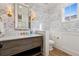 Charming powder room with stylish wallpaper, modern fixtures, and decorative lighting at 2130 S Milwaukee St, Denver, CO 80210