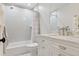 Full bathroom features a shower-tub combo with subway tile and a marble vanity at 2130 S Milwaukee St, Denver, CO 80210