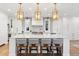 Spacious kitchen featuring marble island with seating and top-of-the-line appliances at 2130 S Milwaukee St, Denver, CO 80210