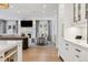 Open floor plan showcasing kitchen with living room including fireplace, and backyard access at 2130 S Milwaukee St, Denver, CO 80210