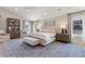 Spacious main bedroom features natural light, large windows, and soft, neutral tones at 2130 S Milwaukee St, Denver, CO 80210