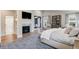 Bright main bedroom featuring a fireplace, sitting area, and ensuite bathroom at 2130 S Milwaukee St, Denver, CO 80210