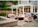 Beautiful patio with outdoor kitchen, cozy seating around a fire pit, and integrated spa at 2130 S Milwaukee St, Denver, CO 80210