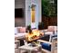 Charming patio featuring a modern fire pit with stone, comfortable seating, and landscaped greenery at 2130 S Milwaukee St, Denver, CO 80210
