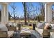 Inviting covered porch with comfortable seating, offering picturesque views of the neighborhood at 2130 S Milwaukee St, Denver, CO 80210