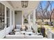 Relaxing covered porch featuring stylish furniture and a tranquil outdoor ambiance at 2130 S Milwaukee St, Denver, CO 80210
