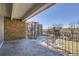 Private balcony with railing and views of the courtyard at 955 Eudora St # 407E, Denver, CO 80220