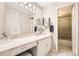 Full bathroom featuring a large mirror, and a shower over the bath at 955 Eudora St # 407E, Denver, CO 80220