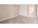 Neutral bedroom featuring a closet with louvered doors and neutral carpet at 955 Eudora St # 407E, Denver, CO 80220