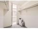 Walk-in closet with shelving, railing and a view of the bathroom at 955 Eudora St # 407E, Denver, CO 80220