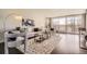 Inviting living room featuring a comfortable sofa, a large rug, and floor to ceiling windows at 955 Eudora St # 407E, Denver, CO 80220