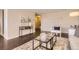 Cozy living room with stylish decor, a glass coffee table, and an accent rug at 955 Eudora St # 407E, Denver, CO 80220