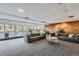 Inviting lounge area with comfortable sofas, stylish coffee table, and large windows offering views of the outdoors at 955 Eudora St # 407E, Denver, CO 80220