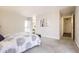 Spacious main bedroom featuring soft carpet and access to a luxurious ensuite bathroom at 955 Eudora St # 407E, Denver, CO 80220