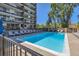 Community outdoor pool with lounge chairs for relaxing at 955 Eudora St # 407E, Denver, CO 80220