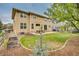 Spacious backyard with a patio, lawn, seating, BBQ and fully fenced perimeter at 1033 Petras St, Erie, CO 80516