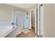 Clean bathroom with glass enclosed shower and soaking tub at 1033 Petras St, Erie, CO 80516