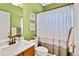 Fresh bathroom featuring a vanity with bronze fixtures and neutral-toned shower curtain at 1033 Petras St, Erie, CO 80516