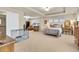 Spacious bedroom features neutral tones, a sitting area, and plenty of natural light at 1033 Petras St, Erie, CO 80516