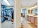 Walk in closet leading to Primary bathroom and vanity at 1033 Petras St, Erie, CO 80516