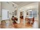 Welcoming entryway with hardwood floors, a dining table, and staircase at 1033 Petras St, Erie, CO 80516
