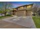 Charming two-story home featuring a three-car garage and covered front porch at 1033 Petras St, Erie, CO 80516