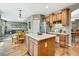Spacious kitchen with a center island, wooden cabinets, and stainless steel appliances at 1033 Petras St, Erie, CO 80516