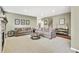 Comfortable living room featuring two gray sofas and a round coffee table at 1033 Petras St, Erie, CO 80516