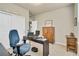 Functional home office space with desk, chair, and storage, ideal for remote work at 1033 Petras St, Erie, CO 80516