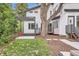 Charming backyard with pergola, mature trees, and stylish landscaping at 1533 S Columbine St, Denver, CO 80210