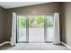 Large sliding doors opening to outdoor terrace with green leafy views at 1533 S Columbine St, Denver, CO 80210