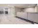 Finished basement with plank flooring, neutral paint, and recessed lighting, ready for customization and relaxation at 1533 S Columbine St, Denver, CO 80210