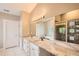 Bright bathroom featuring double sink with marble counters and a glass shower at 1533 S Columbine St, Denver, CO 80210