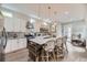 Well-designed kitchen with white cabinets, marble countertops, and a rustic wood island at 1533 S Columbine St, Denver, CO 80210