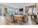 Cozy living room featuring a modern fireplace, large windows, and stylish decor providing a comfortable and inviting atmosphere at 1533 S Columbine St, Denver, CO 80210