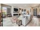 Comfortable living room with hardwood floors, a fireplace, stylish decor, and ample seating space for entertaining guests at 1533 S Columbine St, Denver, CO 80210