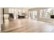 Spacious living area boasts hardwood floors, stairs and a large sliding glass doors opening to an outdoor patio at 1533 S Columbine St, Denver, CO 80210