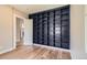 Room with hardwood floors and large blue bookcase at 1533 S Columbine St, Denver, CO 80210