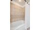 Updated bathroom featuring neutral tile surround at 30321 Chestnut Dr, Evergreen, CO 80439