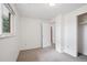 Cozy room with light walls and carpeting and door to closet and entry to another room at 30321 Chestnut Dr, Evergreen, CO 80439