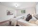 Bright bedroom with hardwood flooring, large windows, and neutral color palette at 30321 Chestnut Dr, Evergreen, CO 80439