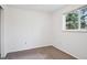 Bright, cozy bedroom features a window, neutral walls, and carpeted floors at 30321 Chestnut Dr, Evergreen, CO 80439