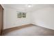 Bright bedroom featuring a window, neutral walls, and carpeted floors at 30321 Chestnut Dr, Evergreen, CO 80439