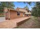 Brick house with an attached garage and a stamped concrete driveway, blending functionality with aesthetic appeal at 30321 Chestnut Dr, Evergreen, CO 80439