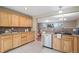 Well-lit kitchen with custom wood cabinets, granite countertops, and stainless steel appliances, offering a functional workspace at 30321 Chestnut Dr, Evergreen, CO 80439