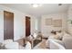 Bright living room featuring a neutral color scheme and cozy seating arrangements at 30321 Chestnut Dr, Evergreen, CO 80439
