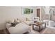 Living room featuring neutral paint, plush carpet, and a large window at 30321 Chestnut Dr, Evergreen, CO 80439