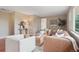 Stylish living room with a mix of textures, a modern coffee table, and natural light, creating a warm and inviting space at 30321 Chestnut Dr, Evergreen, CO 80439