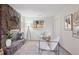Living room featuring a stone fireplace at 30321 Chestnut Dr, Evergreen, CO 80439